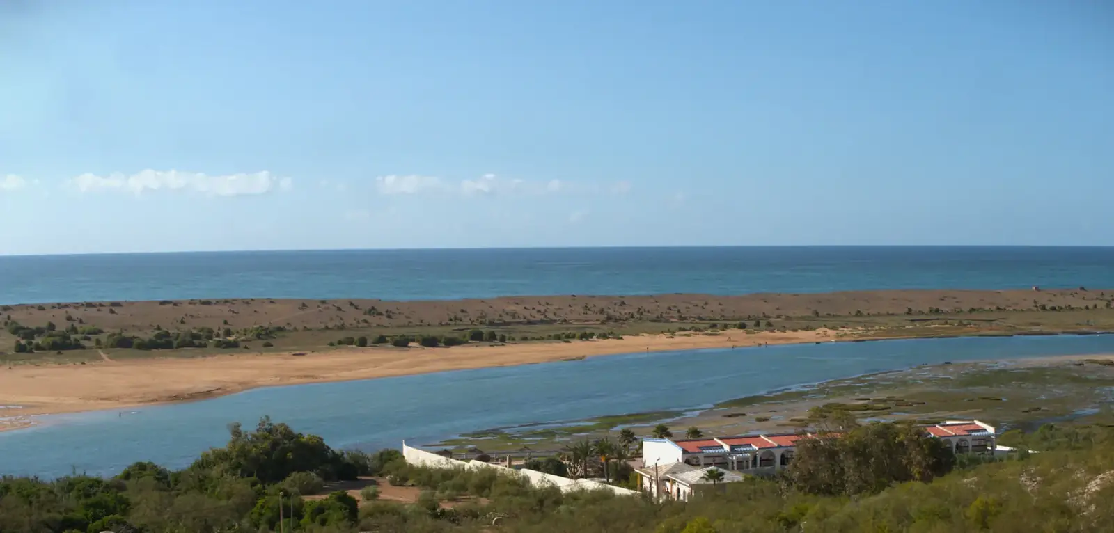 The calm lagoon of Oualidia behind its sand bar on the Atlantic