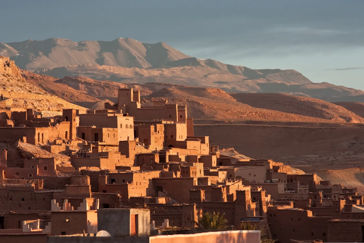 Kasbah walls glowing at sunset below the High Atlas